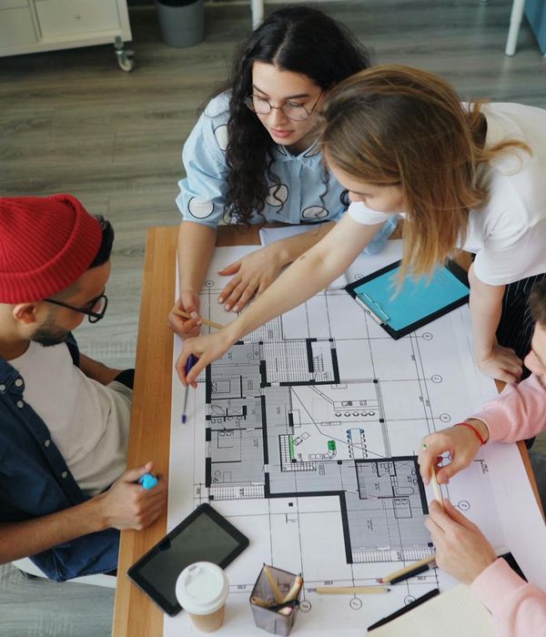 Software development team collaborating on tech project in modern workspace