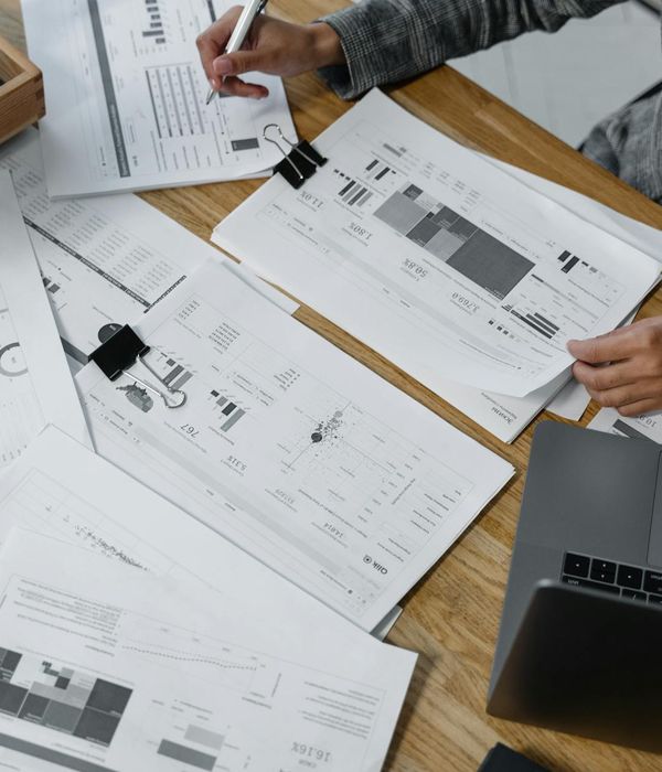 Woman executive in business environment reviewing financial documents